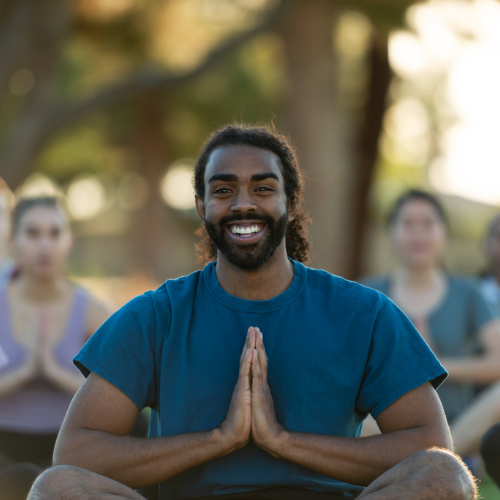 man smiling yoga